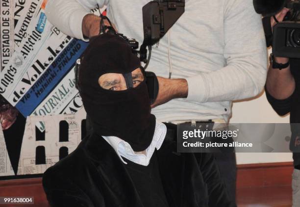 Gaspare Mutolo, former Sicilian mafioso and drug dealer wears a black mask and sits in front of media representatives in Rome, Italy, 17 November...