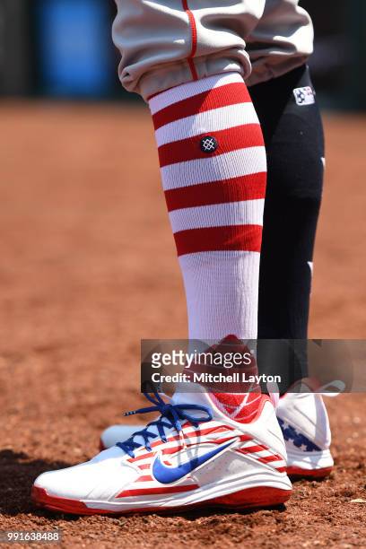 Blake Swihart of the Boston Red Sox wears red, white and blue shoes and socks for the Fourth of July during a baseball game against the Washington...