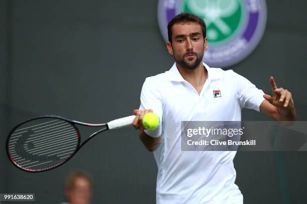 Marin Cilic of Croatia returns against Guido Pella of Argentina during their Men's Singles second round match on day three of the Wimbledon Lawn...