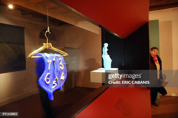 "Des oeuvres de Dali et Braque réalisées par Daum exposées à Carmaux". Salvador Dali's "Melting Clock" in cristal paste is displayed at the Museum of...