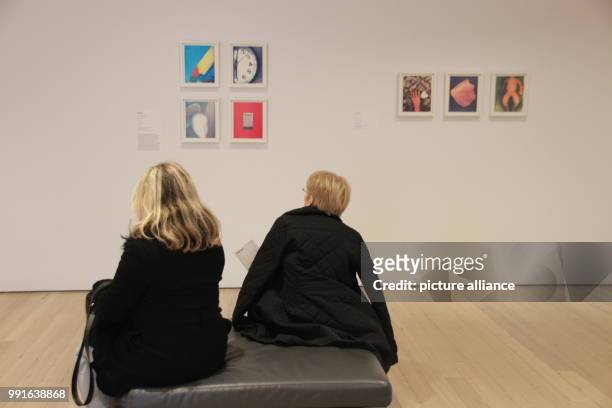 Visitors sitting in front of works by Lesley Schiff at the Whitney Museum of American Art in New York's Manhattan, USA, 17 November 2017. The...