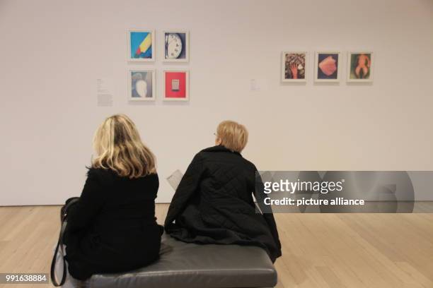 Visitors sitting in front of works by Lesley Schiff at the Whitney Museum of American Art in New York's Manhattan, USA, 17 November 2017. The...