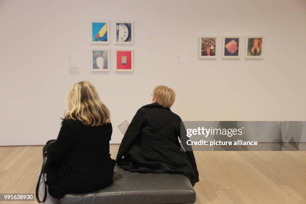 Visitors sitting in front of works by Lesley Schiff at the Whitney Museum of American Art in New York's Manhattan, USA, 17 November 2017. The...