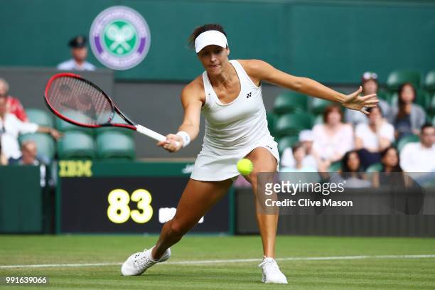 Kristina Mladenovic of France returns against Tatjana Maria of Germay during their Ladies' Singles second round match on day three of the Wimbledon...