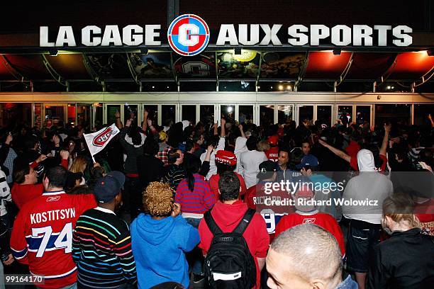 Fans outside the Bell Centre watch the final seconds Game Seven of the Eastern Conference Semifinals between the Montreal Canadiens and Pittsburgh...