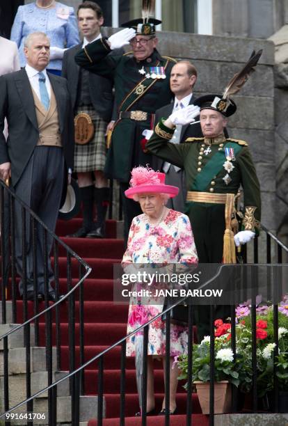 Britain's Queen Elizabeth II hosts the annual garden party at the Palace of Holyroodhouse in Edinburgh on July 4, 2018.