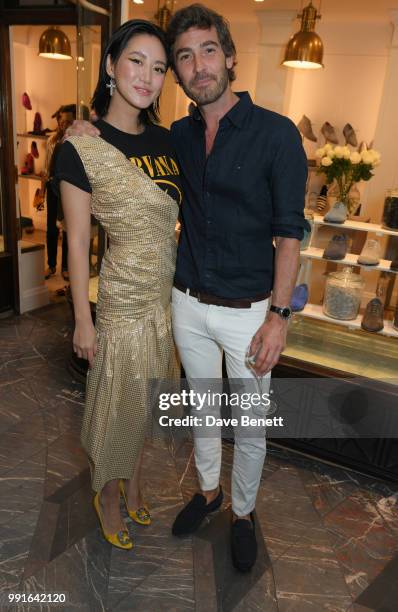 Betty Bachz and Robert Konjic attend the Manolo Blahnik Colourful Garden Party at Burlington Arcade on July 4, 2018 in London, England.