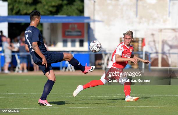 Kostadin Velkov of Chemnitzer FC and Simon Hedlund of 1 FC Union Berlin during the test match between Chemnitzer FC and Union Berlin at...