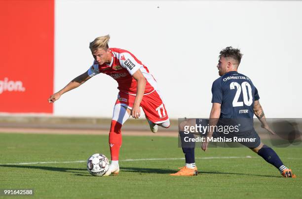Simon Hedlund of 1 FC Union Berlin and Pascal Itter of Chemnitzer FC during the test match between Chemnitzer FC and Union Berlin at...