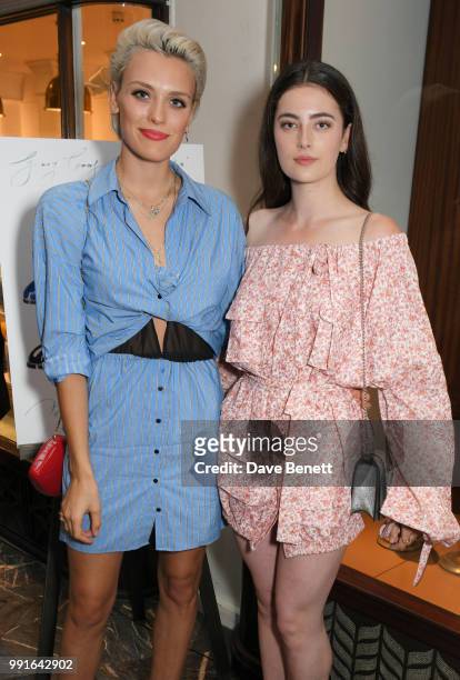 Wallis Day and Millie Brady attend the Manolo Blahnik Colourful Garden Party at Burlington Arcade on July 4, 2018 in London, England.