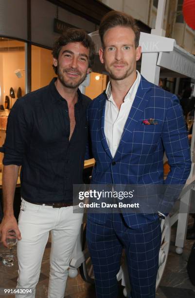 Robert Konjic and Craig McGinlay attend the Manolo Blahnik Colourful Garden Party at Burlington Arcade on July 4, 2018 in London, England.