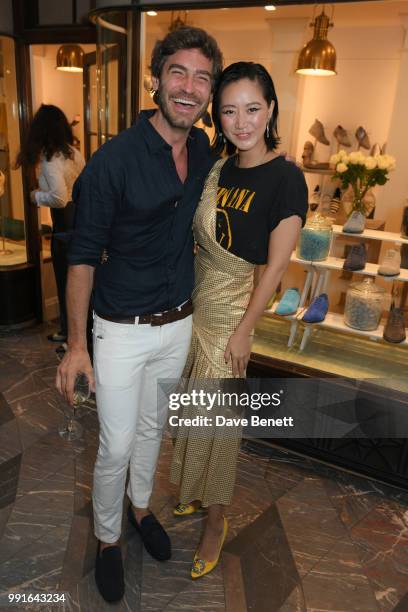 Robert Konjic and Betty Bachz attend the Manolo Blahnik Colourful Garden Party at Burlington Arcade on July 4, 2018 in London, England.