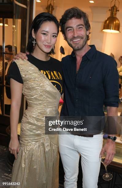 Betty Bachz and Robert Konjic attend the Manolo Blahnik Colourful Garden Party at Burlington Arcade on July 4, 2018 in London, England.