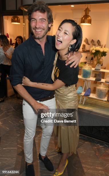 Robert Konjic and Betty Bachz attend the Manolo Blahnik Colourful Garden Party at Burlington Arcade on July 4, 2018 in London, England.