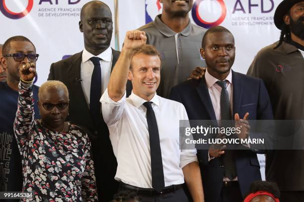 French-Beninese artist Angelique Kidjo , French President Emmanuel Macron pose for a familly photo with former pro basketball players from NBA Africa...