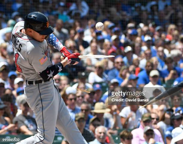 JaCoby Jones of the Detroit Tigers breaks his bat on a foul ball during the first inning against the Chicago Cubs on July 4, 2018 at Wrigley Field in...
