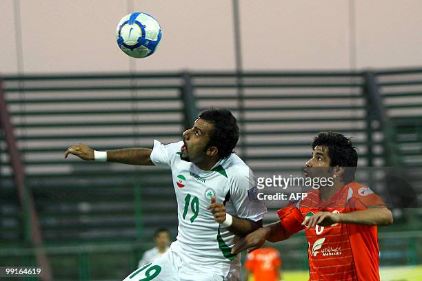 Mes Kerman's Pirooz Ghorbani challenges Zobahan's Mohammad Ghazi as he goes for a header during their AFC Champions League round of 16 football match...