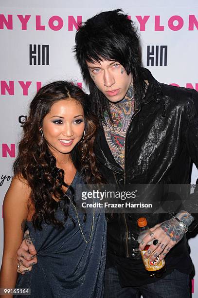 Actress Brenda Song and Trace Cyrus pose at the NYLON & YouTube Young Hollywood Party at the Roosevelt Hotel on May 12, 2010 in Hollywood, California.