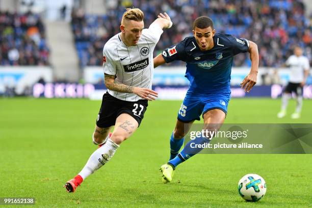 Hoffenheim's Kevin Akpoguma and Frankfurt's Marius Wolf vie for the ball during the German Bundesliga match between 1899 Hoffenheim and Eintracht...