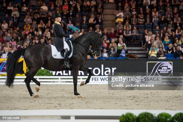 The German dressage rider Isabell Werth riding on her horse Weihegold OLD during the award ceremony of the 33rd horse show for the World Cup...