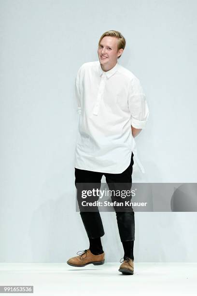 Designer Danny Reinke acknowledges the applause of the audience after his show during the Berlin Fashion Week Spring/Summer 2019 at ewerk on July 4,...