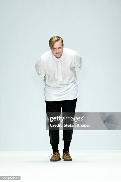 Designer Danny Reinke acknowledges the applause of the audience after his show during the Berlin Fashion Week Spring/Summer 2019 at ewerk on July 4,...