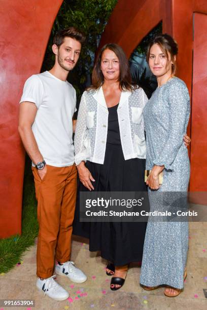 Pierre Niney, Bonpoint Artistic Director Christine Innamorato and Natacha Andrews attend the Bonpoint Haute Couture Fall/Winter 2018-2019 show as...
