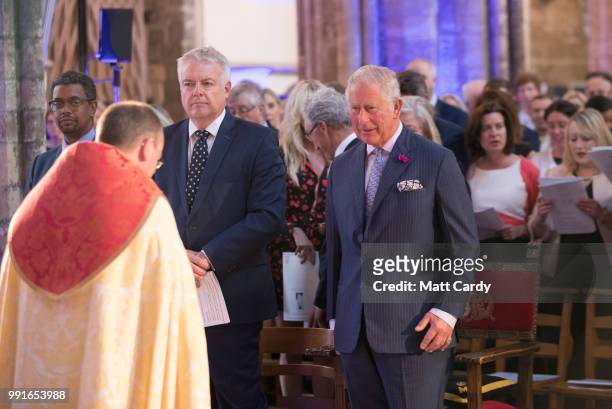 Prince Charles, Prince of Wales is accompanied by Rt. Hon. Carwyn Jones AM, the First Minister of Wales as he attends a thanksgiving service to...