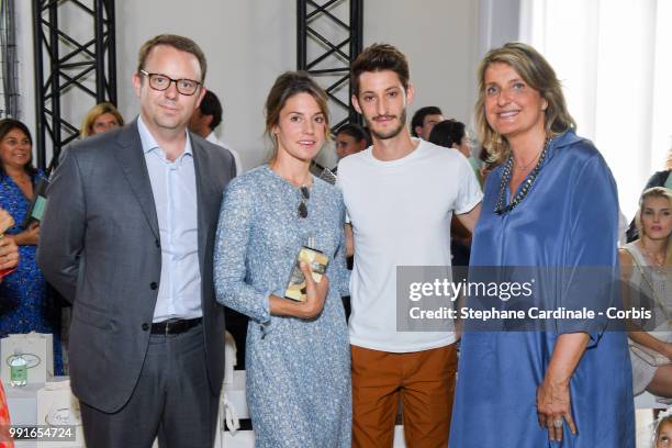 Christopher Descours, Natacha Andrews, Pierre Niney and Marie-Sabine Leclercq attend the Bonpoint Haute Couture Fall/Winter 2018-2019 show as part of...