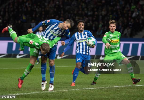 Berlin's Vedad Ibisevic and Valentino Lazaro in action against Moenchengladbach's Matthias Ginter and Nico Elvedi during the German Bundesliga soccer...