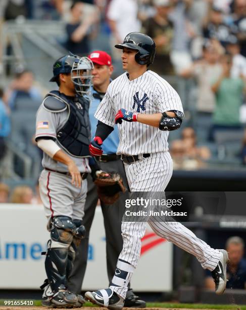 Kyle Higashioka of the New York Yankees crosses home plate after his fourth inning home run against the Atlanta Braves at Yankee Stadium on July 4,...