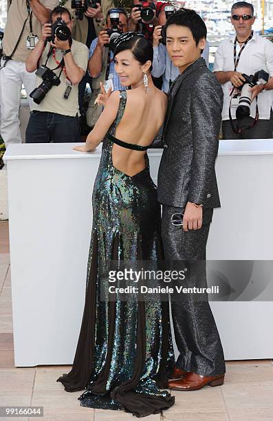 Actors Li Feier and Yi Zi attend the 'Chongging Blues' Photocall held at the Palais Des Festivals during the 63rd Annual International Cannes Film...