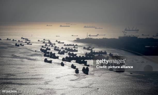 Numerous ships lying in the roads in the harbour of Chittagong, Bangladesch, 19 November 2017. Chittagong is one of the world's largest ship...