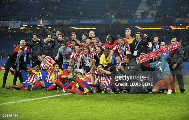 Aletico Madrid's players celebrate with the trophy after winning the final football match of the UEFA Europa League Fulham FC vs Aletico Madrid in...