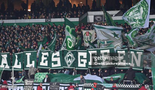 Bremen's fans hold up a banner saying 'ALLES GEBEN' prior to the German Bundesliga soccer match between Werder Bremen and Hanover 96 in the...