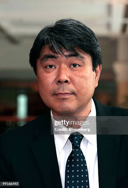 Hideo Majima, director of global marketing and communications of Fast Retailing Co., poses for a photograph at a news conference in Shanghai, China,...