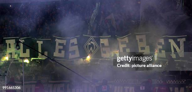 Bremen's fans hold up a banner saying 'ALLES GEBEN' during the German Bundesliga soccer match between Werder Bremen and Hanover 96 in the...