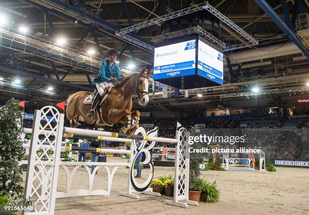 The show jumper Luciana Diniz from Portugal jumps over an obstacle with her horse Fit For Fun 13 during the the FEI World Cup championship at the...