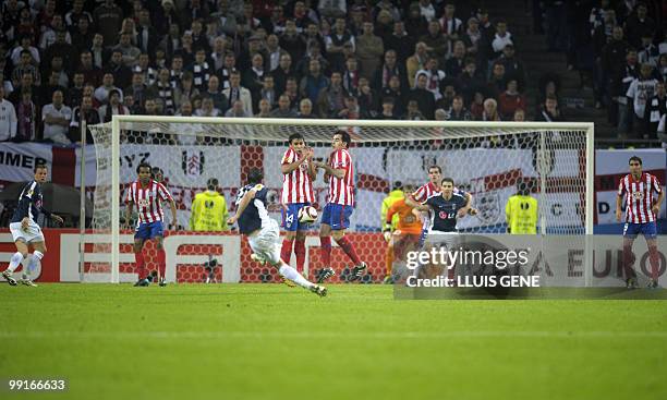 Fulham's Welsh midfielder Simon Davies shoots the ball during the final football match of the UEFA Europa League Fulham FC vs Aletico Madrid in...