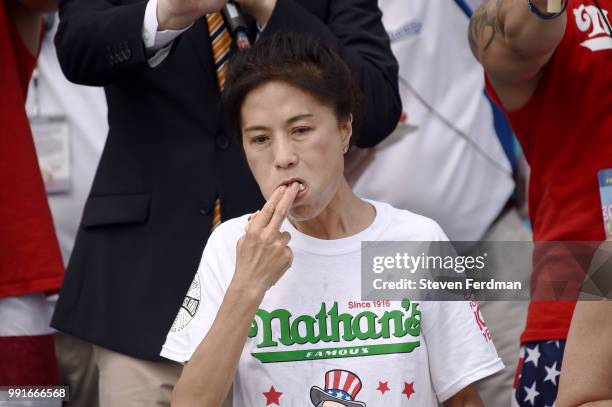 Juliet Lee competes in the women's annual Nathan's Hot Dog Eating Contest on July 4, 2018 in the Coney Island neighborhood of the Brooklyn borough of...