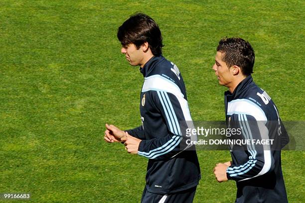 Real Madrid's Brazilian midfielder Kaka and Portuguese forward Cristiano Ronaldo warm up during a training session in Madrid on May 13, 2010. AFP...
