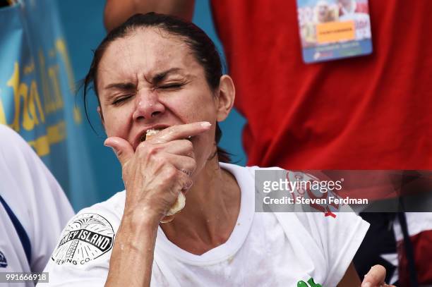 Michelle Lesco competes in the women's annual Nathan's Hot Dog Eating Contest on July 4, 2018 in the Coney Island neighborhood of the Brooklyn...
