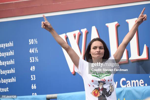 Michelle Lesco competes in the women's annual Nathan's Hot Dog Eating Contest on July 4, 2018 in the Coney Island neighborhood of the Brooklyn...