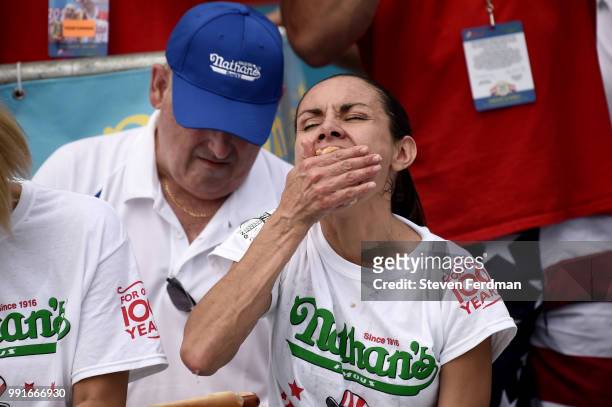 Michelle Lesco competes in the women's annual Nathan's Hot Dog Eating Contest on July 4, 2018 in the Coney Island neighborhood of the Brooklyn...