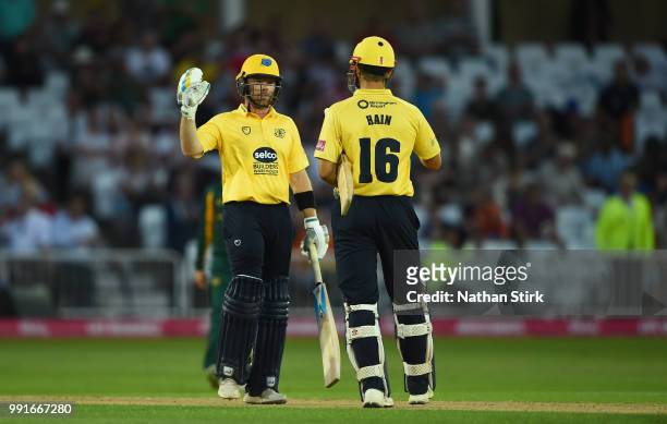 Ian Bell shakes Sam Hain's hand after they beat Nottingham during the Vitality Blast match between Nottingham Outlaws and Birmingham Bears at Trent...