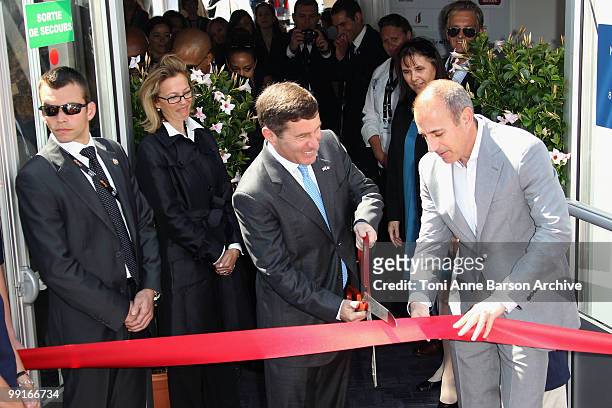 Ambassador to France, Charles H. Riukin and journalist Matt Lauer cut the American Pavilion ribbon at the American Pavilion during the 63rd Annual...