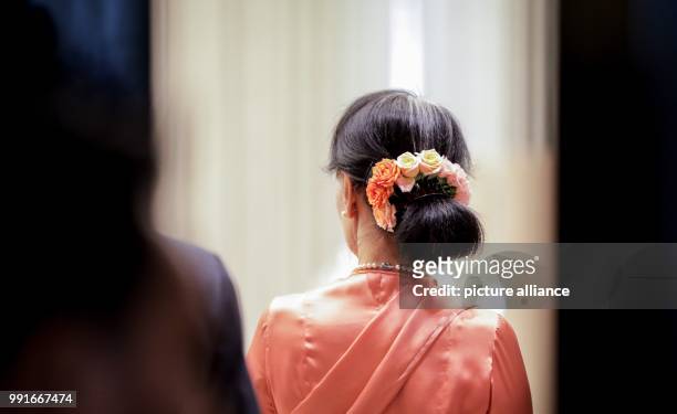 The picture shows the floral decoration in the hair of factual head of state and Foreign Minister Aung San Suu Kyi durin the 13th Asia-Europe Meeting...