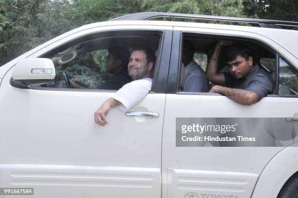 Congress President Rahul Gandhi returns back after meeting with Abdul Sattars family, the farmer who died in May, at Fursatganj, on July 4, 2018 in...