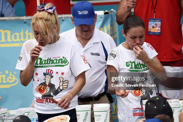 Miki Sudo and Michelle Lesco compete in the women's annual Nathan's Hot Dog Eating Contest on July 4, 2018 in the Coney Island neighborhood of the...