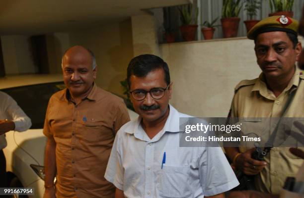 Delhi Chief Minister Arvind Kejriwal with his deputy Manish Sisodia arrive to meet Delhi government lawyer P Chidambaram after Supreme Court ruled in...